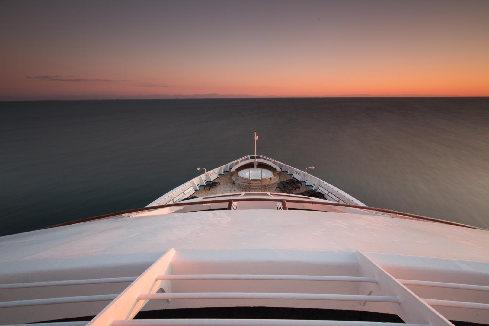 View from the bow of Star Breeze at sunset - Photo Credit: John Greengo